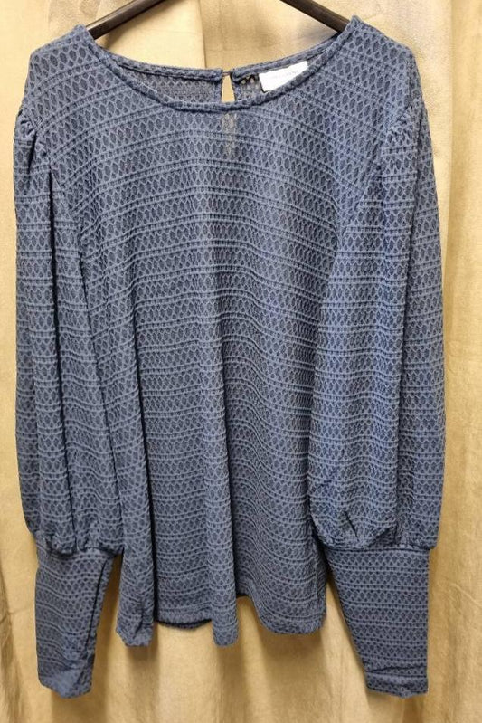 Bluse i en lekker blåfarge med ballongermer