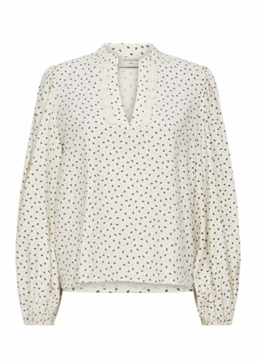 Bluse med lange ermer og prikker