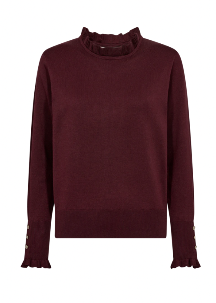 Rød genser med volangdetaljer