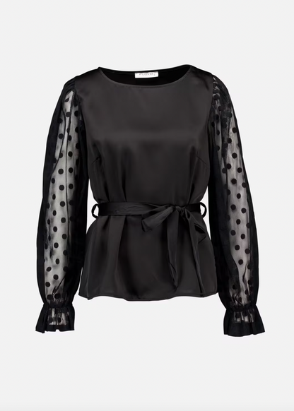 Svart topp med polkadotter